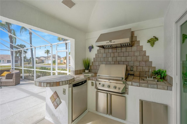 kitchen featuring tile countertops, sink, exhaust hood, and fridge