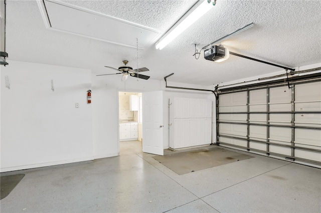 garage featuring ceiling fan and a garage door opener