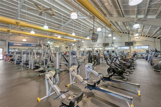 workout area with a high ceiling and ceiling fan