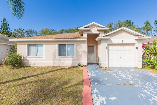 view of front of house featuring a garage and a front lawn