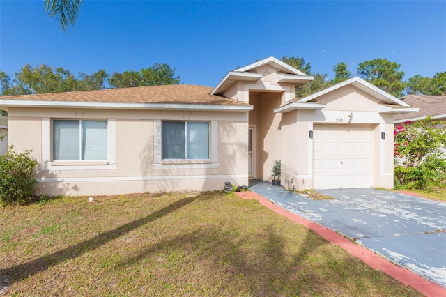 view of front of home with a garage and a front lawn