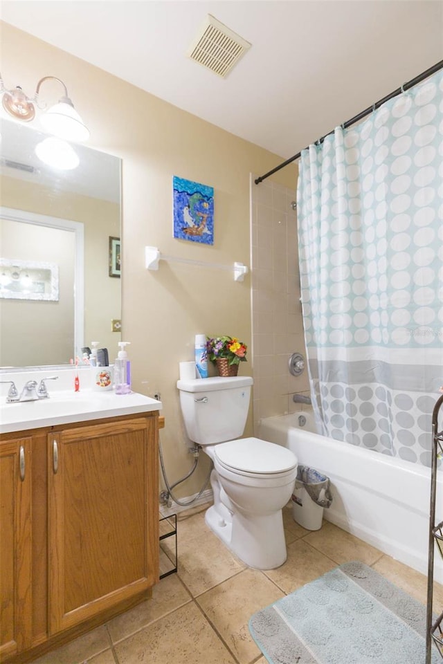 full bathroom featuring toilet, vanity, tile patterned floors, and shower / bath combo with shower curtain