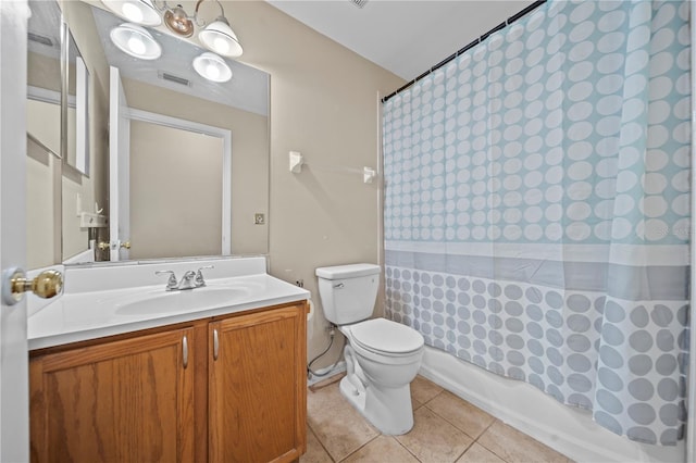 bathroom with visible vents, toilet, shower / bath combo, vanity, and tile patterned floors