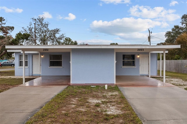 ranch-style house with a carport