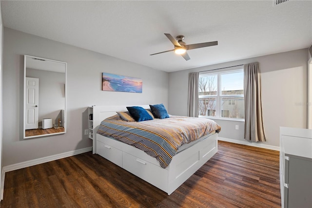 bedroom featuring dark wood-type flooring and ceiling fan