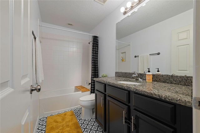 full bathroom with tile patterned flooring, shower / tub combo, vanity, a textured ceiling, and toilet