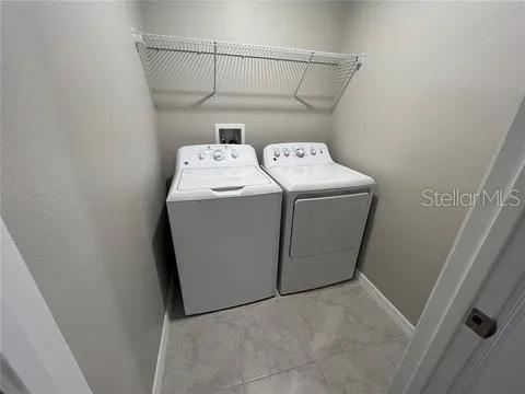 laundry area with washing machine and clothes dryer