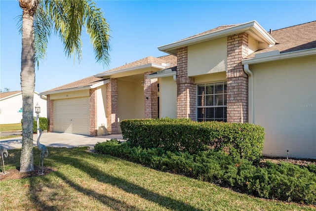 ranch-style home with a garage and a front lawn