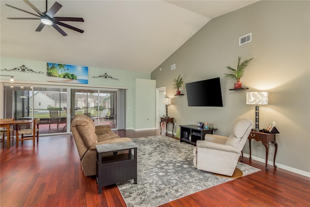 living room featuring ceiling fan, lofted ceiling, and dark wood-type flooring