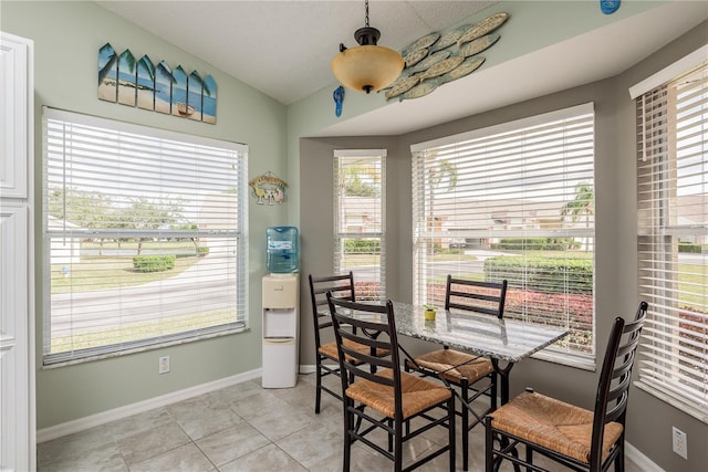 dining space with light tile patterned flooring