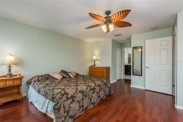 bedroom with a textured ceiling, a closet, ceiling fan, and dark wood-type flooring