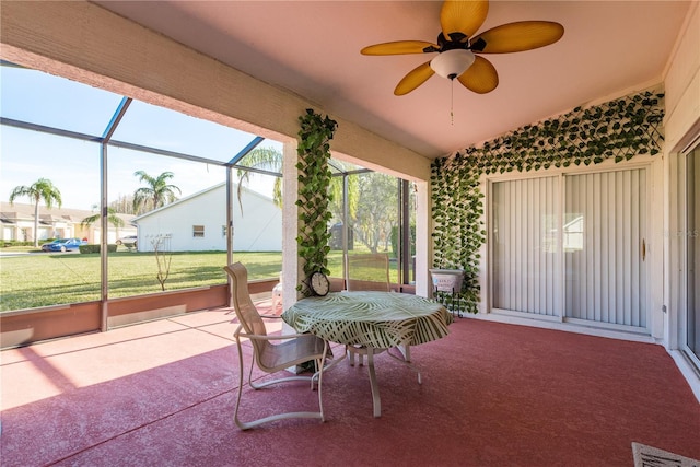 view of patio / terrace featuring glass enclosure and ceiling fan