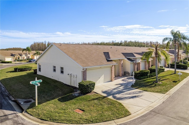 single story home featuring a garage and a front yard