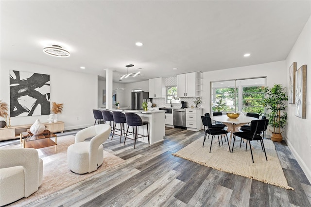 dining space with hardwood / wood-style floors