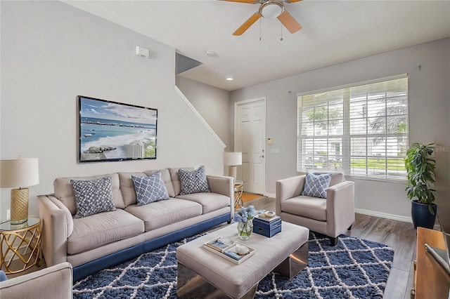 living room with ceiling fan and hardwood / wood-style floors