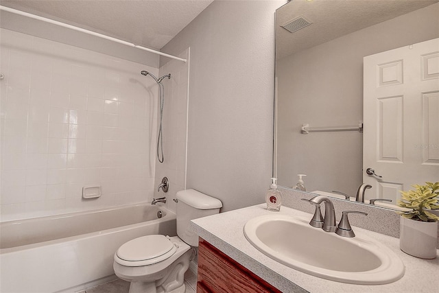 full bathroom with vanity, toilet, washtub / shower combination, and a textured ceiling