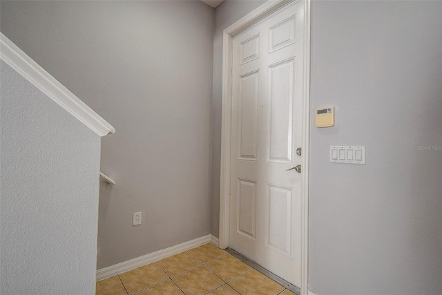 entryway with light tile patterned floors