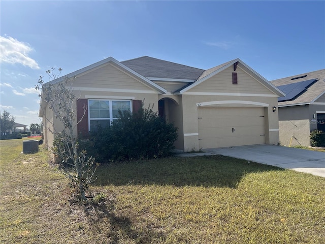 single story home with central AC unit, a front yard, and a garage