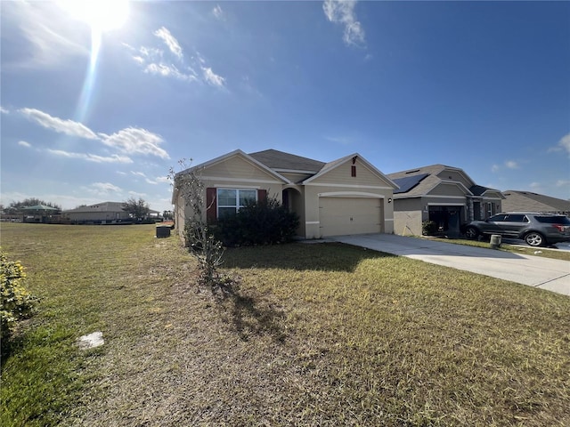 ranch-style house with a garage and a front lawn