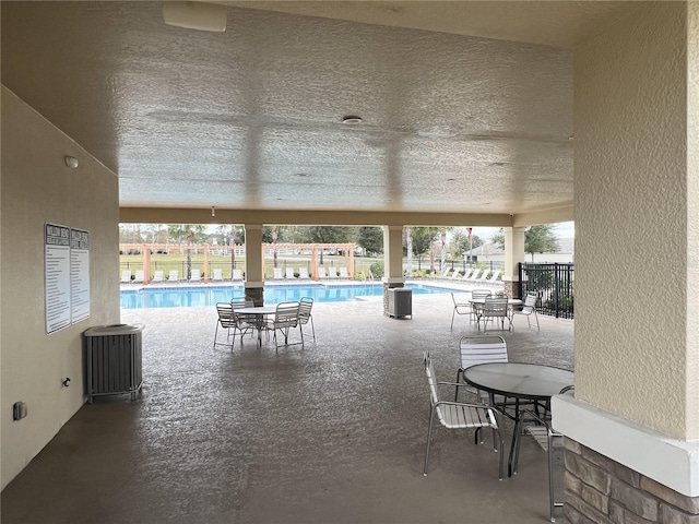 view of pool with central AC and a patio area