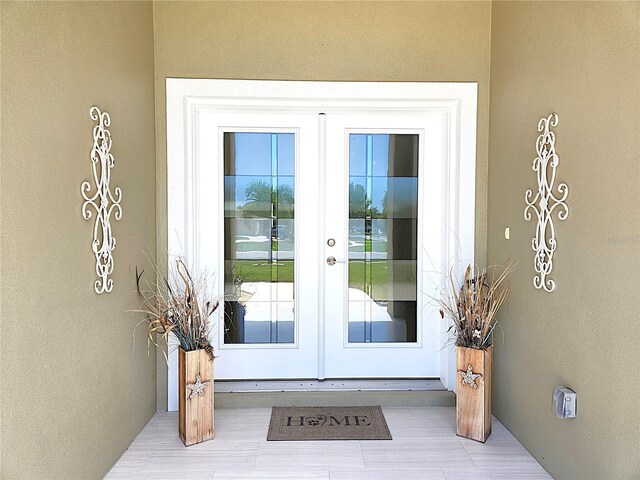 entrance to property featuring french doors