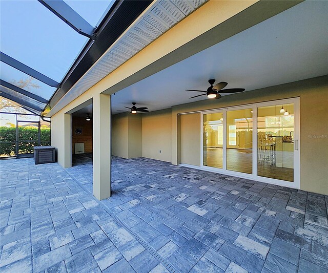 view of patio / terrace with glass enclosure and ceiling fan