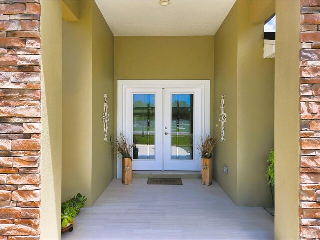 8610 Quinn Ct, North Port, FL 34287 - property entrance with french doors and stucco siding