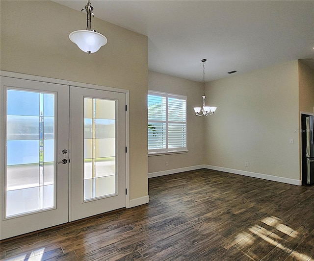 8610 Quinn Ct, North Port, FL 34287 - entryway featuring french doors, visible vents, dark wood finished floors, baseboards, and an inviting chandelier