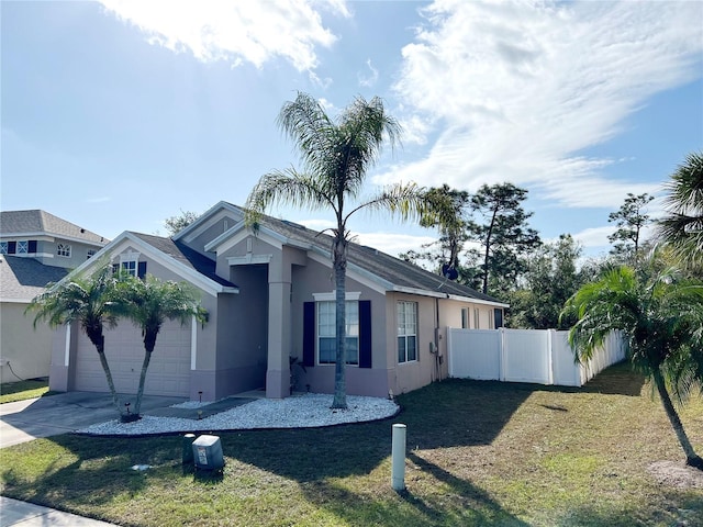 view of front of house with a garage and a front yard