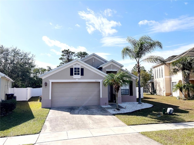 view of front facade featuring a garage and a front yard