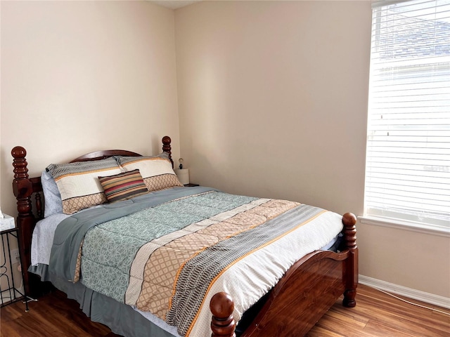 bedroom with hardwood / wood-style floors