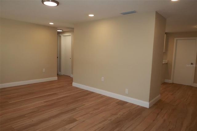 spare room featuring light hardwood / wood-style flooring