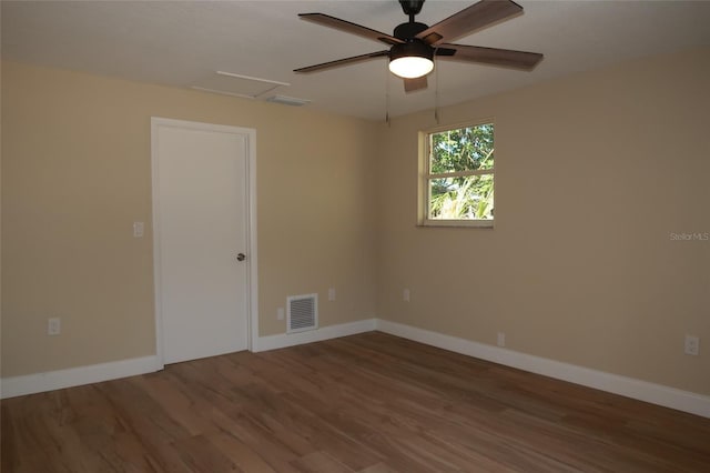 unfurnished room with hardwood / wood-style flooring and ceiling fan