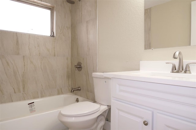 full bathroom featuring toilet, washtub / shower combination, and vanity