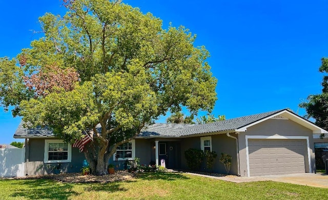3909 W Eden Roc Cir, Tampa, FL 33634 - view of front of property with stucco siding, a garage, and a front lawn