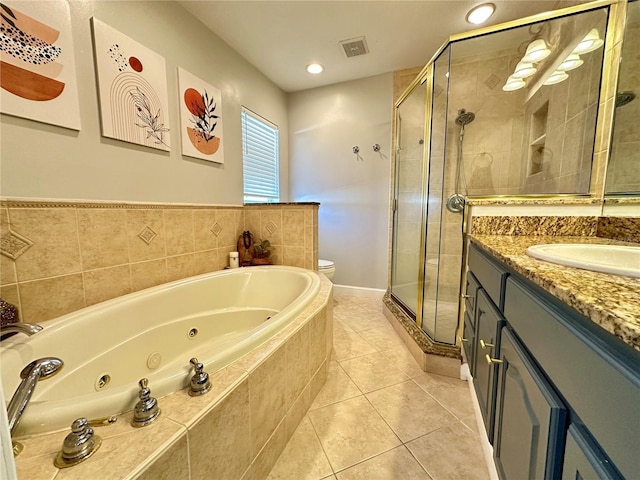 3909 W Eden Roc Cir, Tampa, FL 33634 - full bathroom featuring vanity, a stall shower, a whirlpool tub, toilet, and recessed lighting