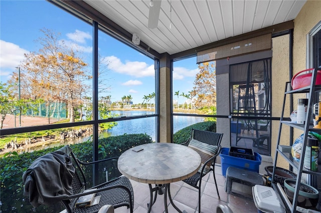 sunroom with a water view