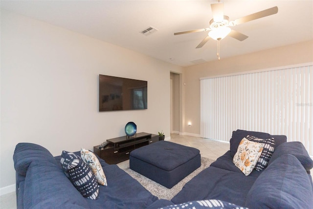 living room featuring ceiling fan and light tile patterned flooring