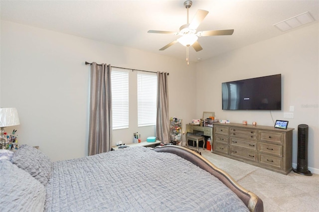 bedroom featuring ceiling fan and light carpet