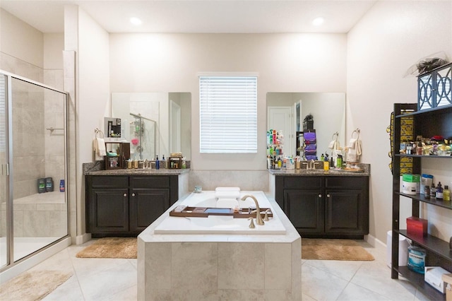 bathroom with vanity, tile patterned flooring, and independent shower and bath