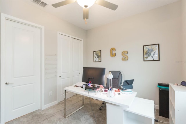 office with ceiling fan and light colored carpet