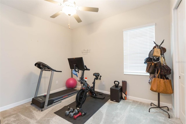 workout area featuring light carpet and ceiling fan