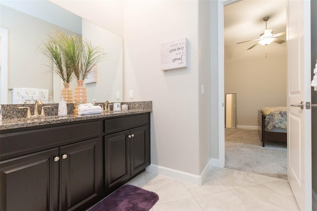 bathroom with tile patterned flooring, ceiling fan, and vanity