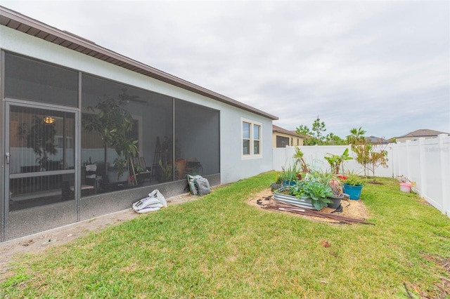 view of yard featuring a sunroom