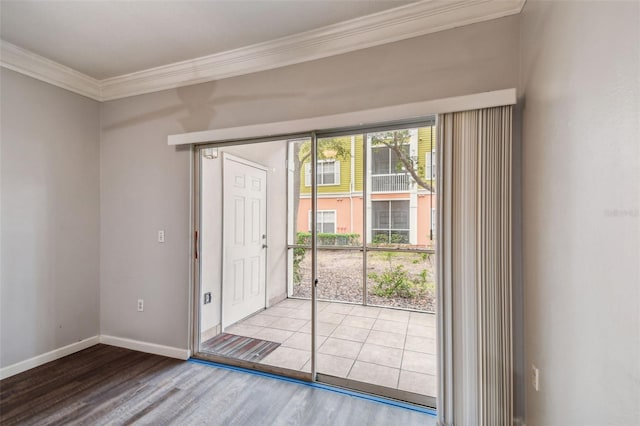 doorway with light wood-type flooring and crown molding