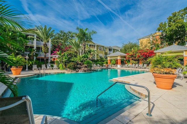 view of swimming pool with a patio