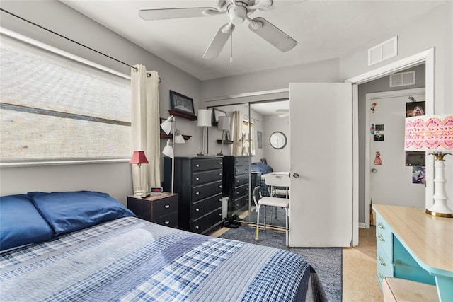 bedroom featuring ceiling fan, a closet, and carpet floors