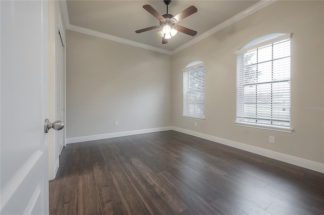 empty room featuring dark hardwood / wood-style flooring, plenty of natural light, ceiling fan, and crown molding