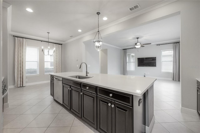 kitchen with dishwasher, sink, crown molding, pendant lighting, and a center island with sink