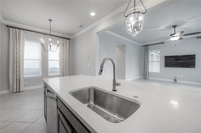 kitchen with pendant lighting, dishwasher, ceiling fan with notable chandelier, crown molding, and sink